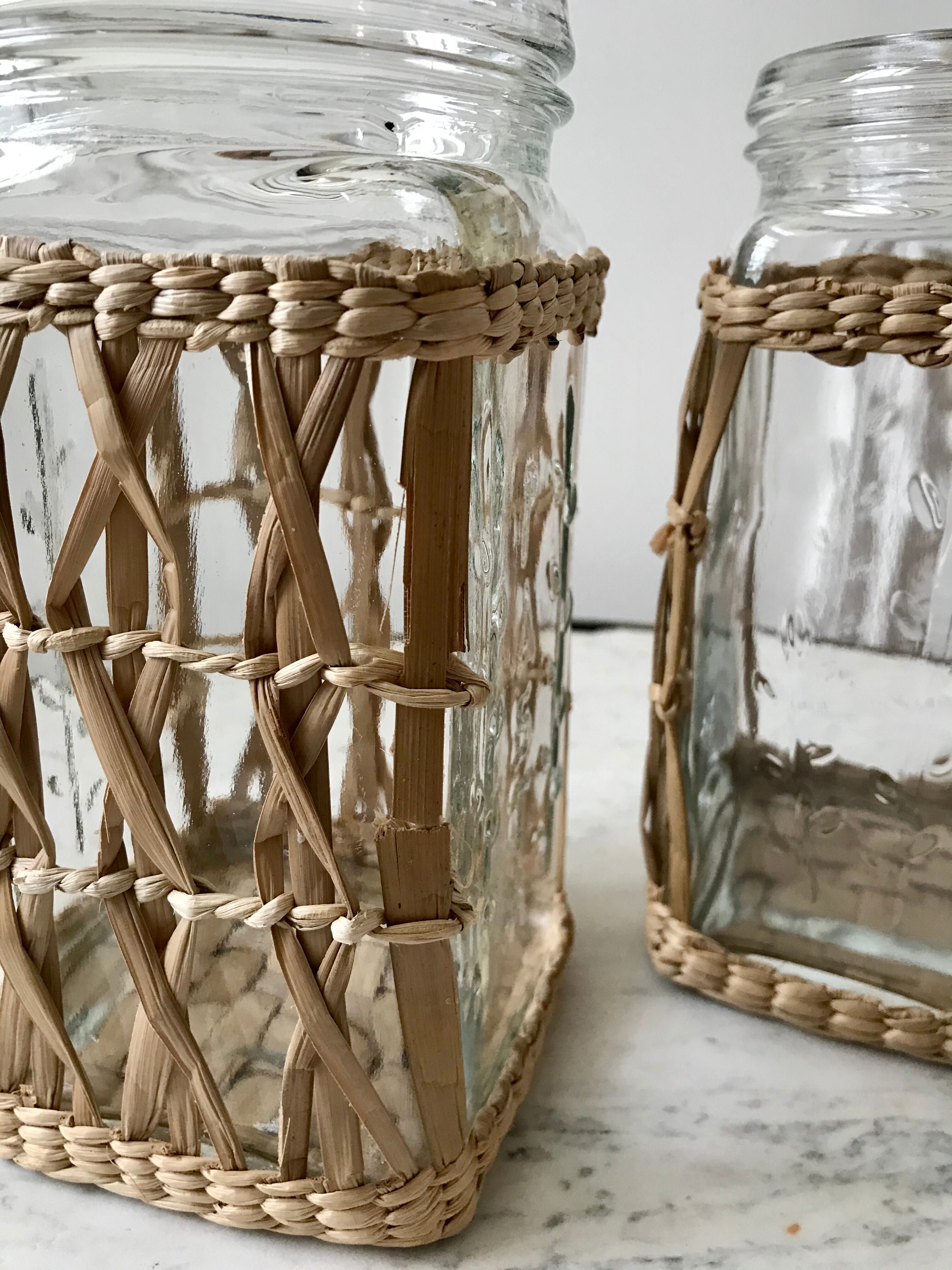 Duo of glass jars surrounded by vintage bamboo