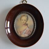 Miniature portrait of a young girl, framed and under glass