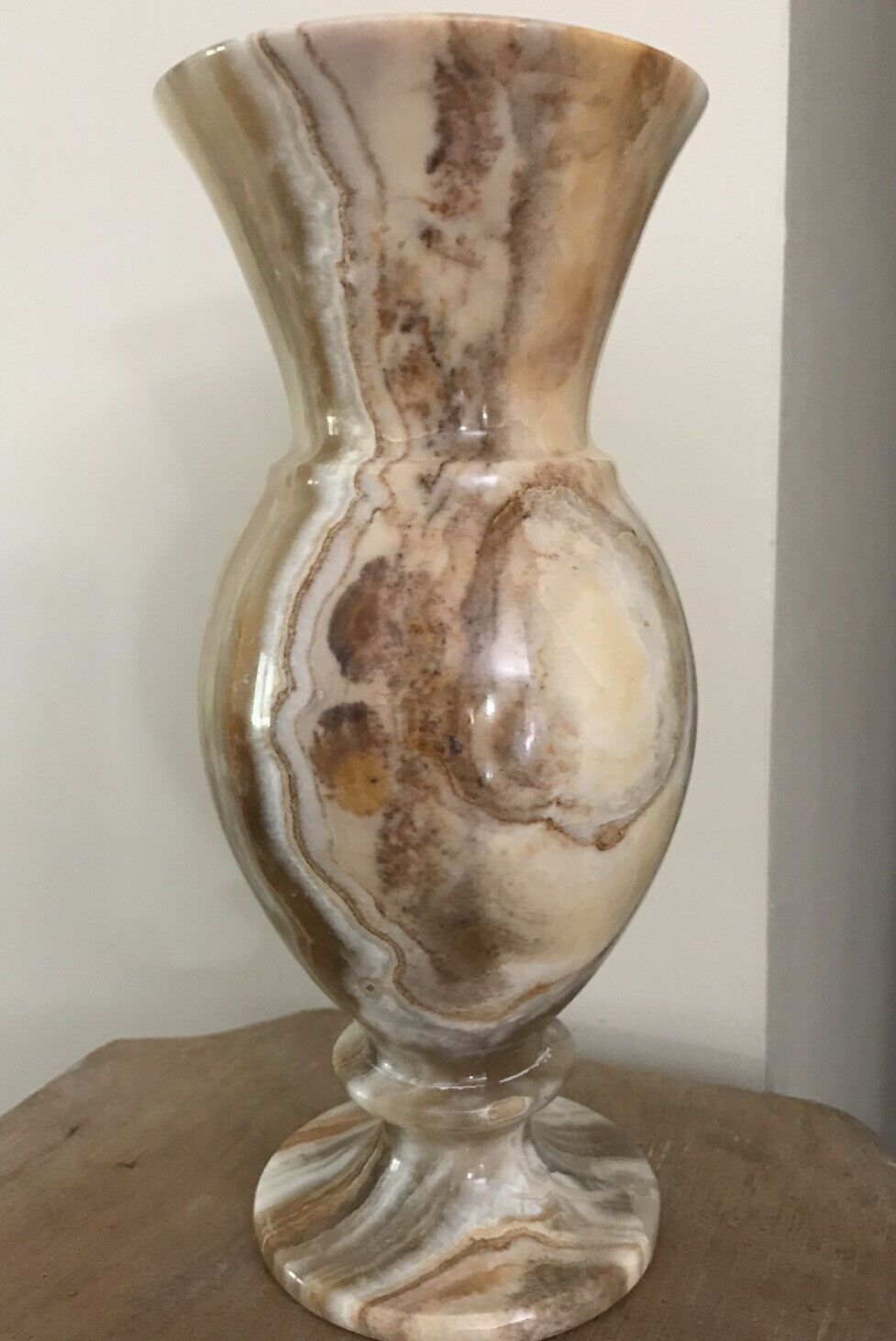 Vintage vase in marbled onyx stone shades of beige and brown