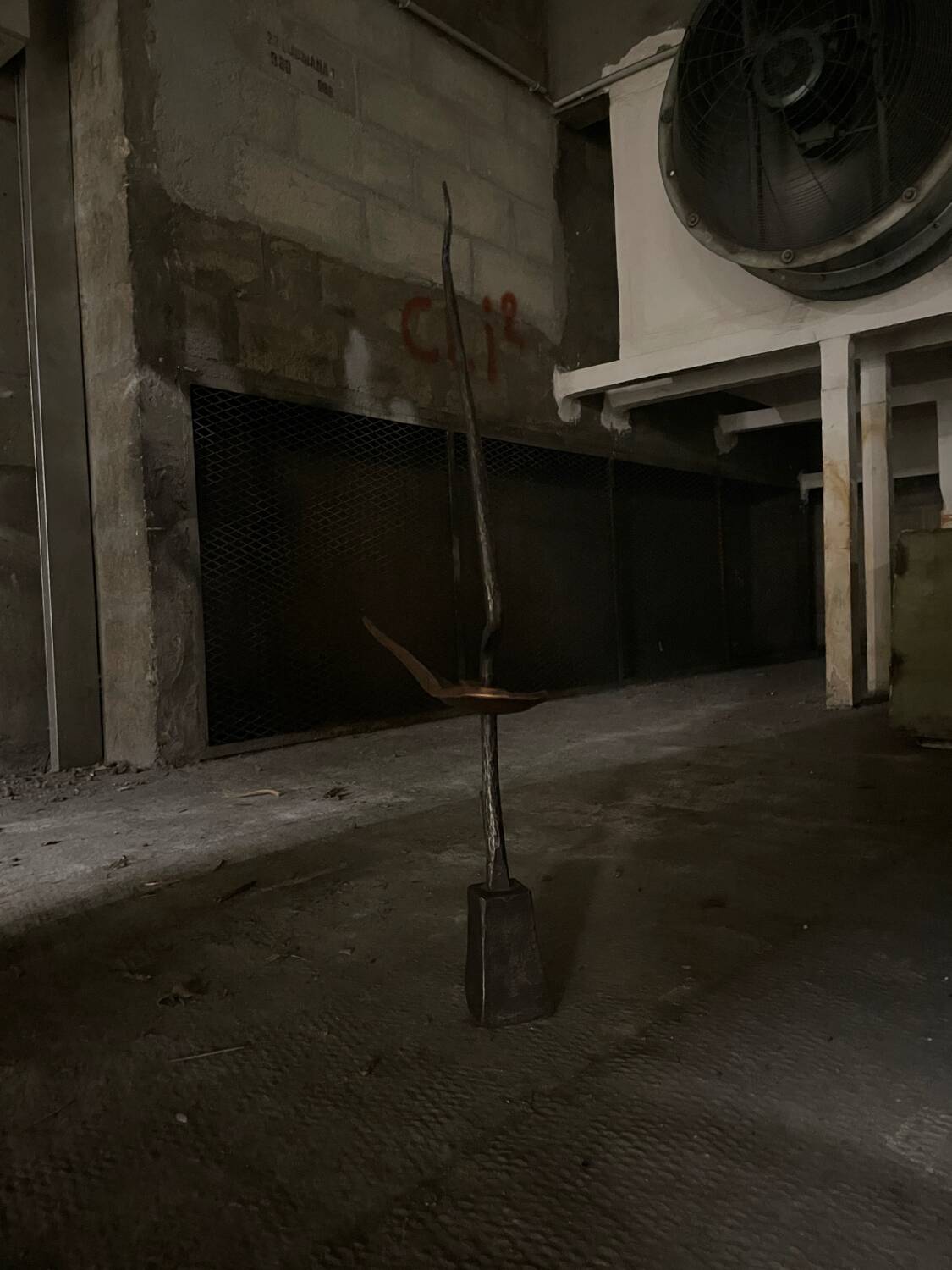 Signed hammered metal and copper sculpture