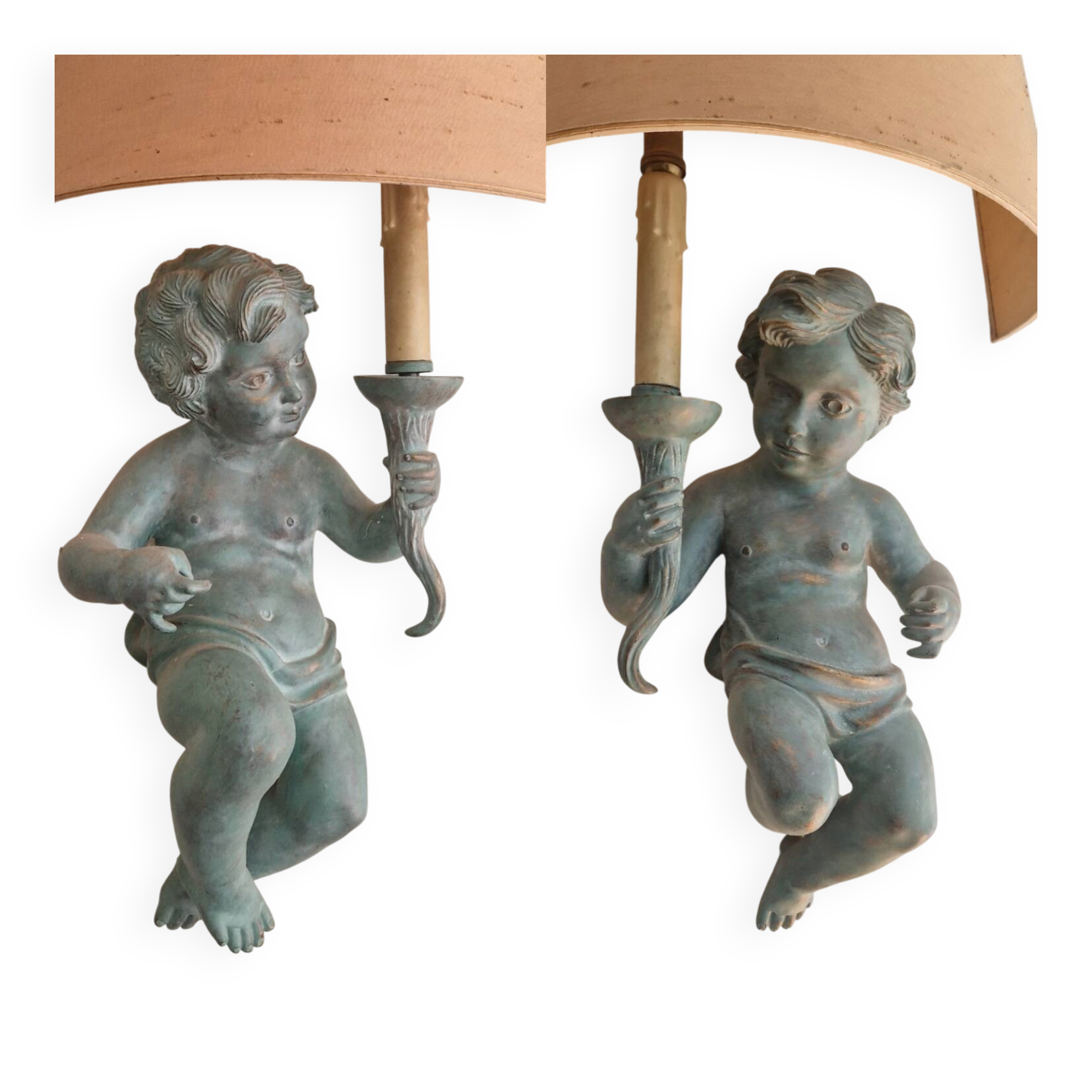 Pairs of wall lights, either two distinct cherubs.