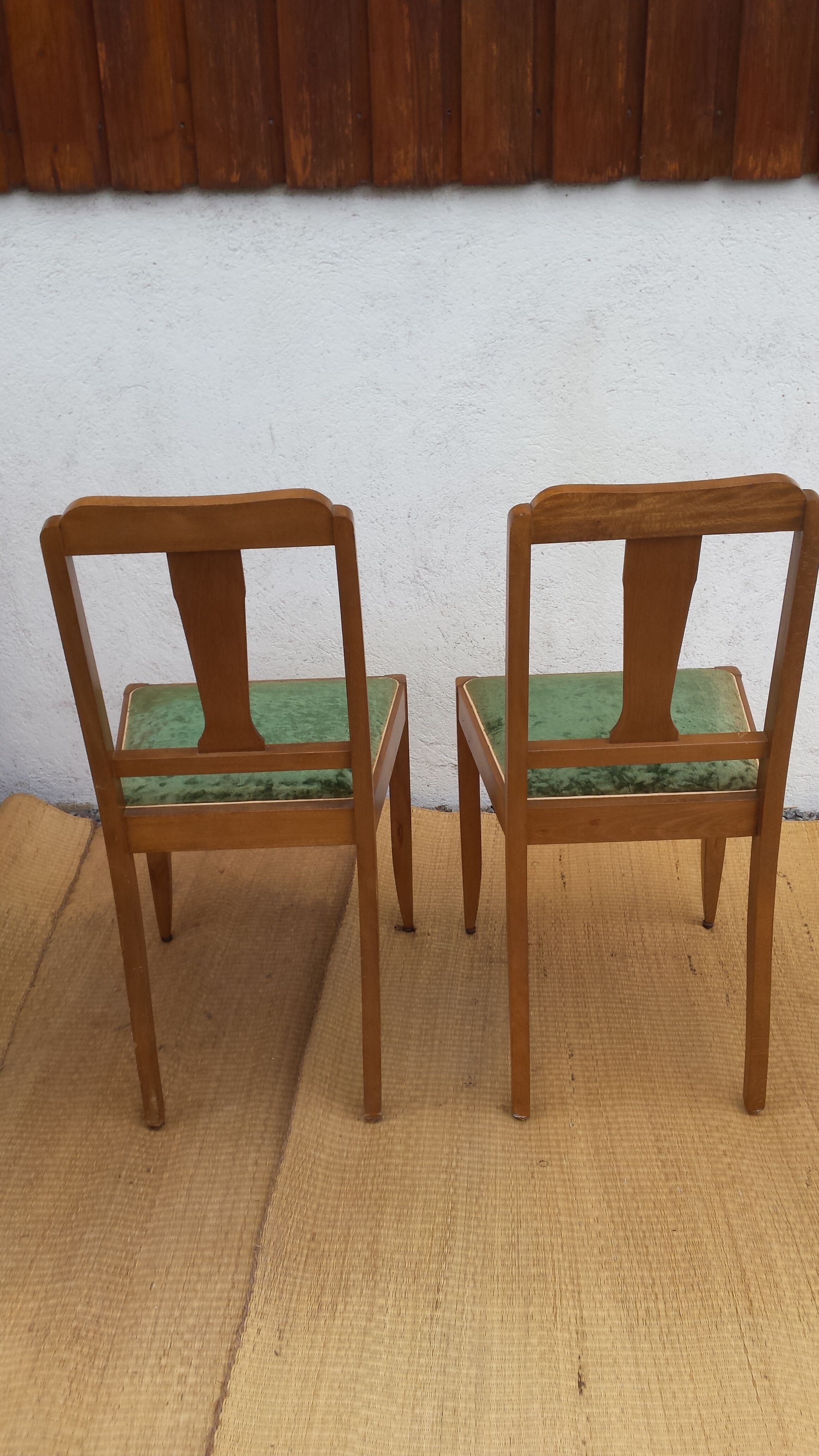 lot of 2 wooden chairs and green velvet