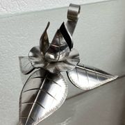 Silver-plated metal flower candle holder