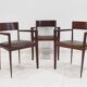 Set of six Italian wooden dining chairs in dark brown faux leather.