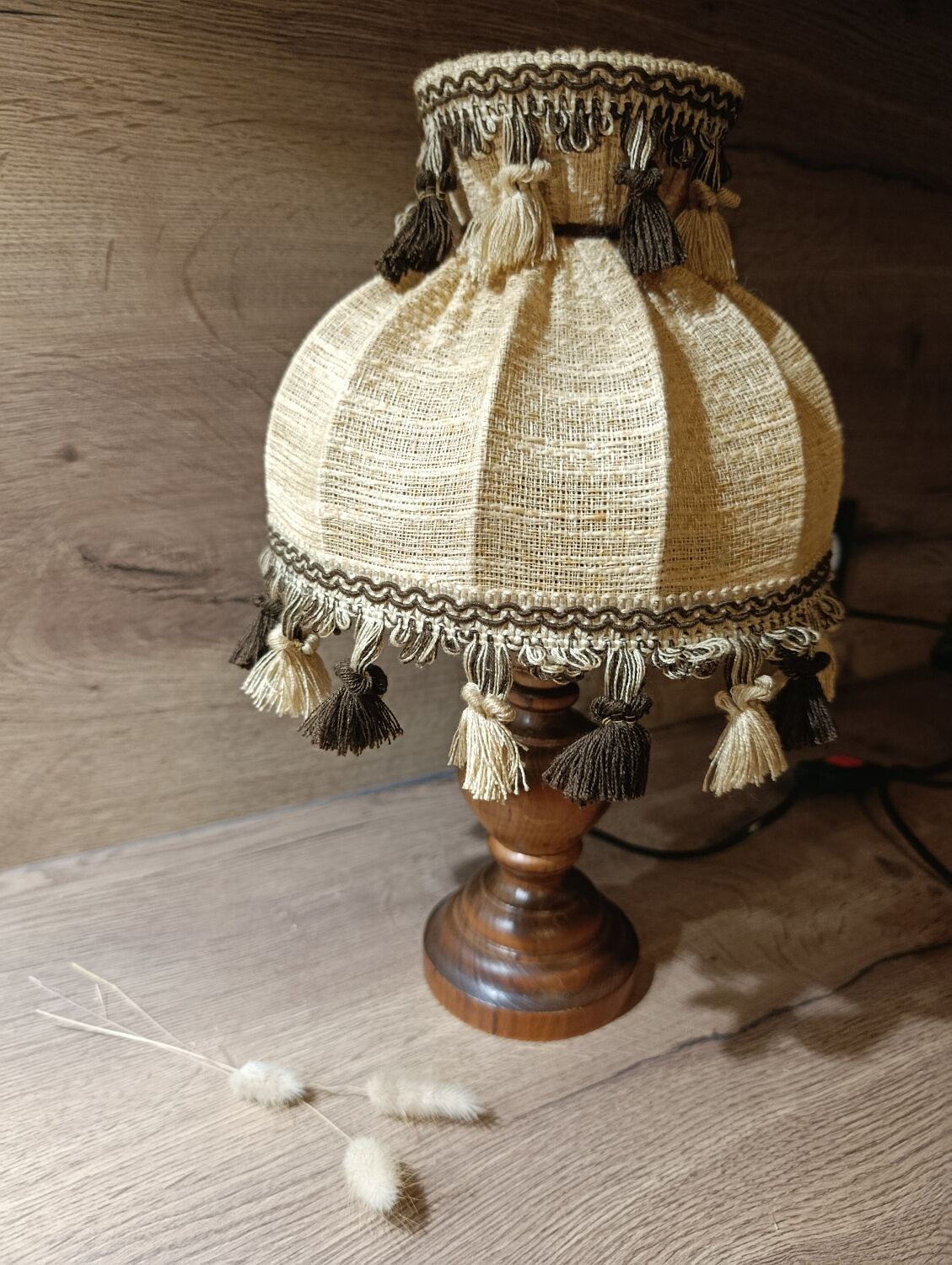 Wood bedside lamp with dome shade in granny chic style.