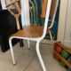 Old wooden and metal children's school chair