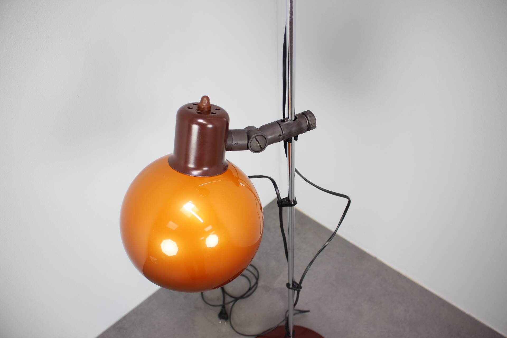 Vintage Hungarian adjustable floor lamp with two orange globe shades, circa 1970.