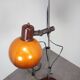 Vintage Hungarian adjustable floor lamp with two orange globe shades, circa 1970.