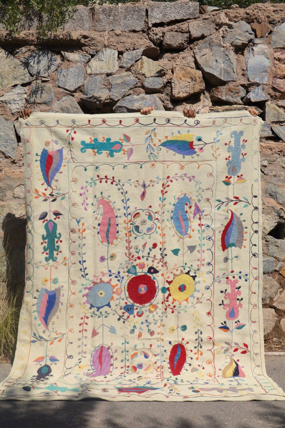 White suzani kilim rug with hand embroidered multi-colored patterns