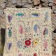 White suzani kilim rug with hand embroidered multi-colored patterns