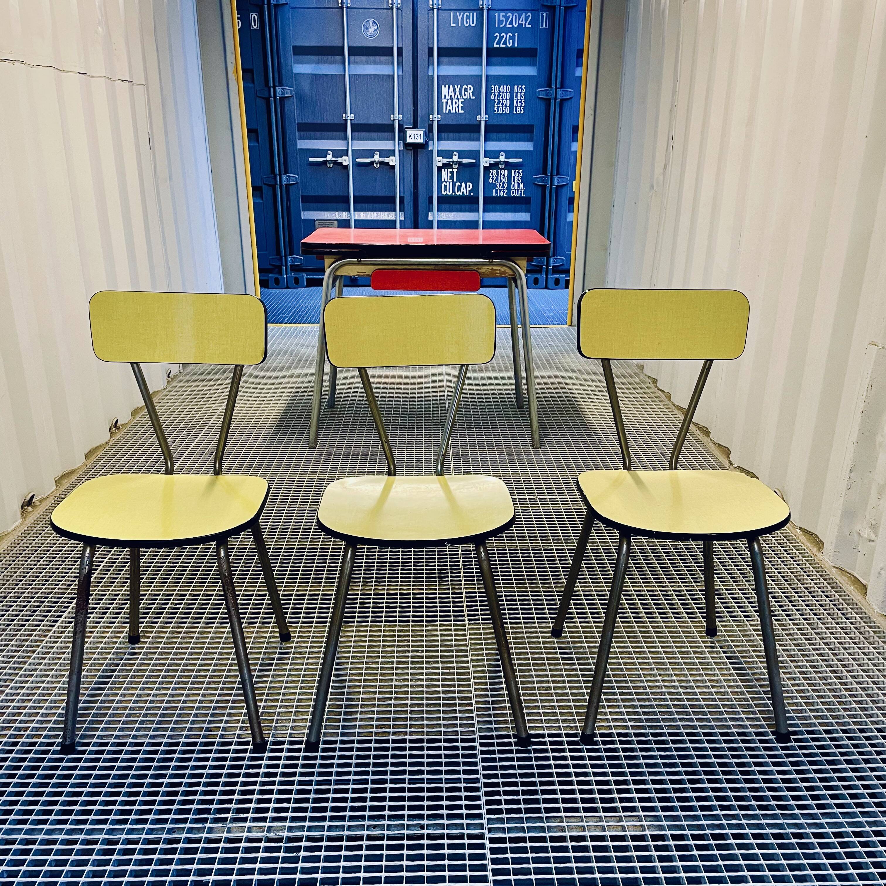 Red Formica table and vintage yellow chairs
