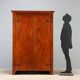 Vintage walnut wardrobe with exposed hardware.