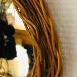 Vintage half moon rattan mirror