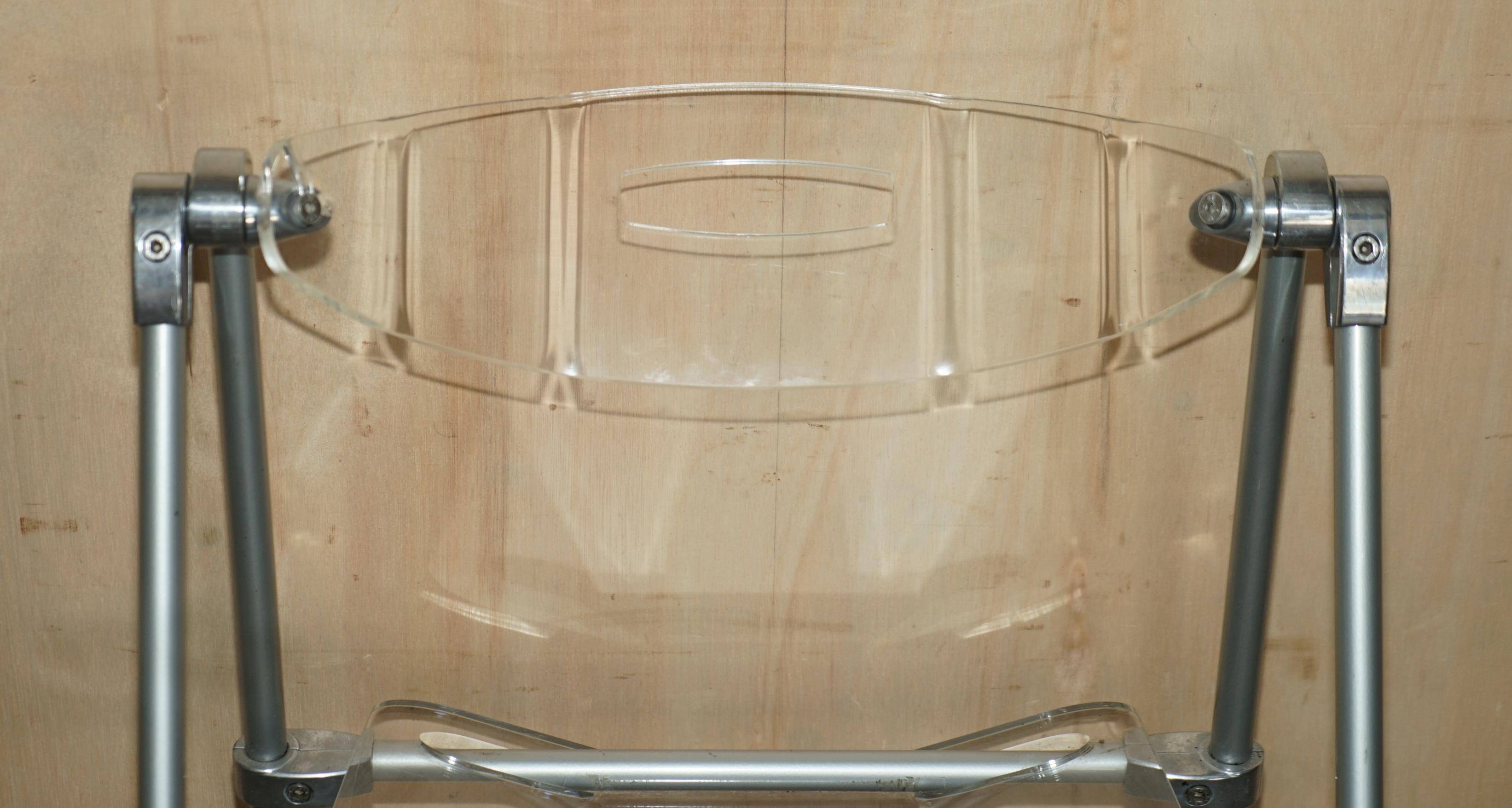 Metal and lucite folding chair, swivel backrest.