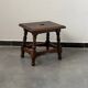 Small antique wooden stool with an openwork pattern.