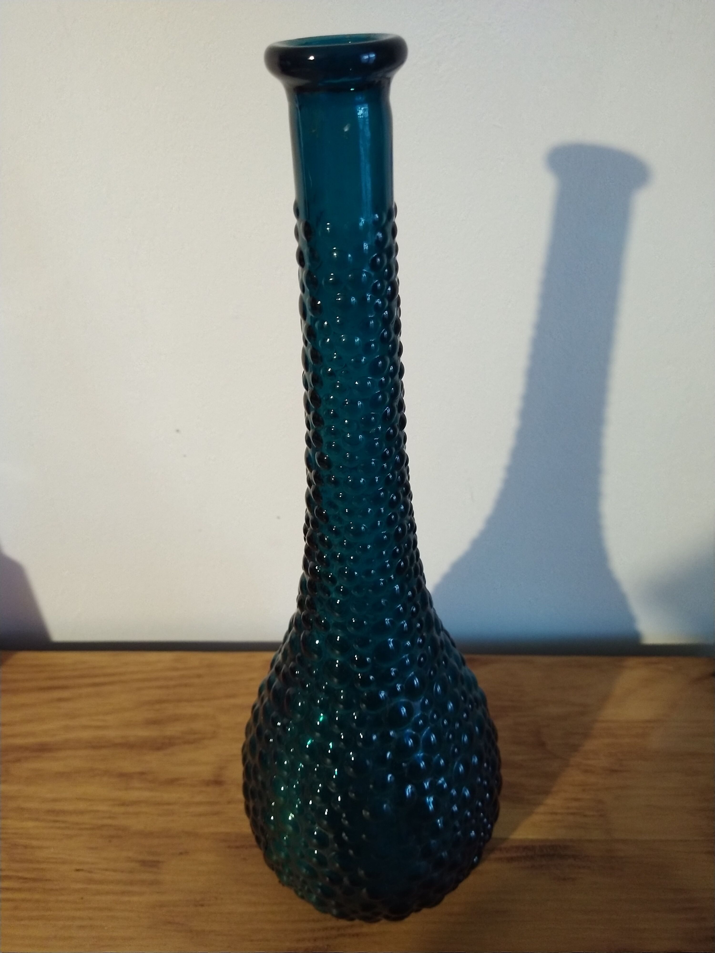 bottle made of blue vintage molded glass