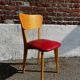 Set of 4 vintage bistro chairs in wood and red faux leather, with splayed legs.