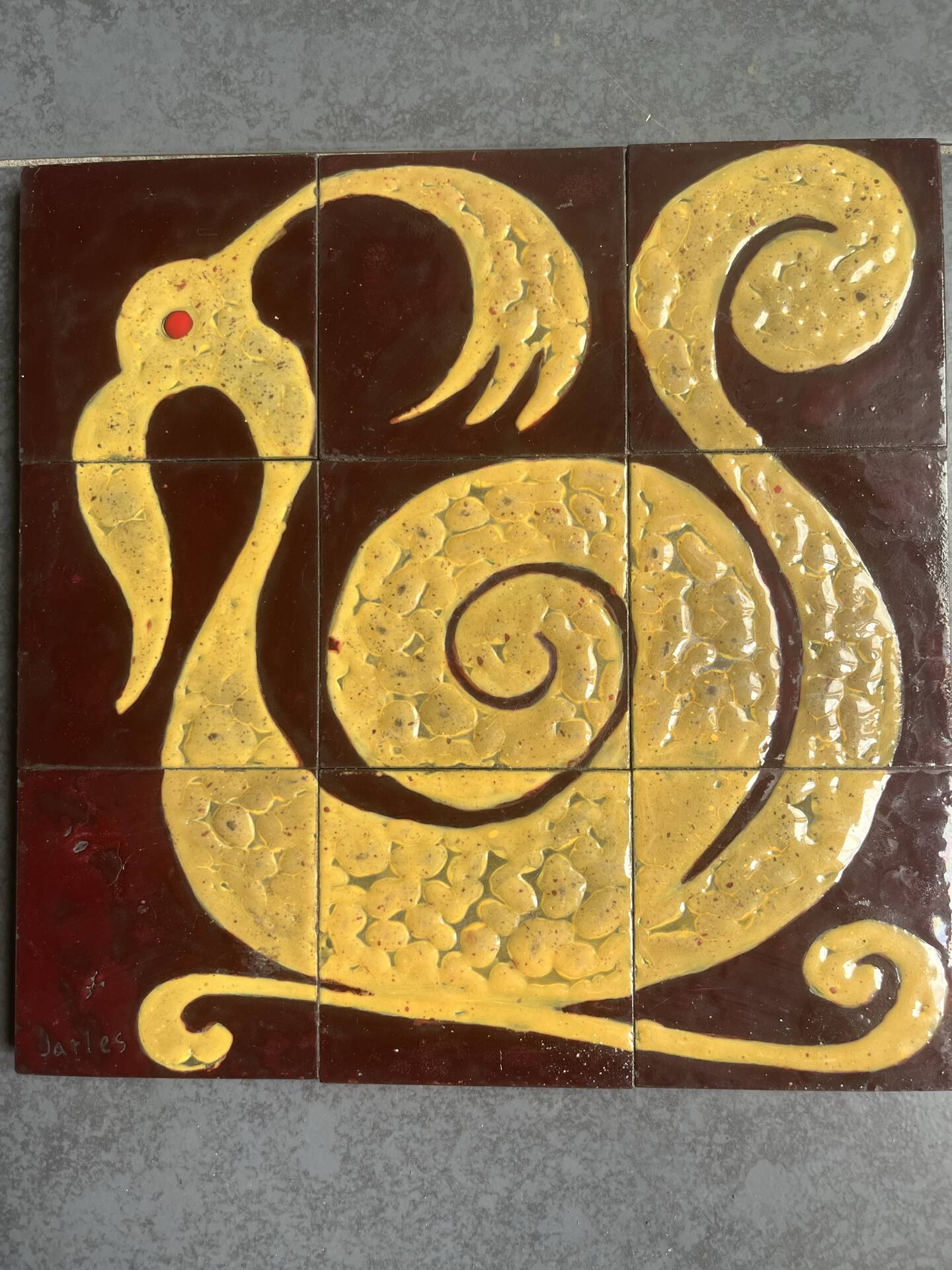Ceramic plaque with zoomorphic pattern made up of 9 tiles.