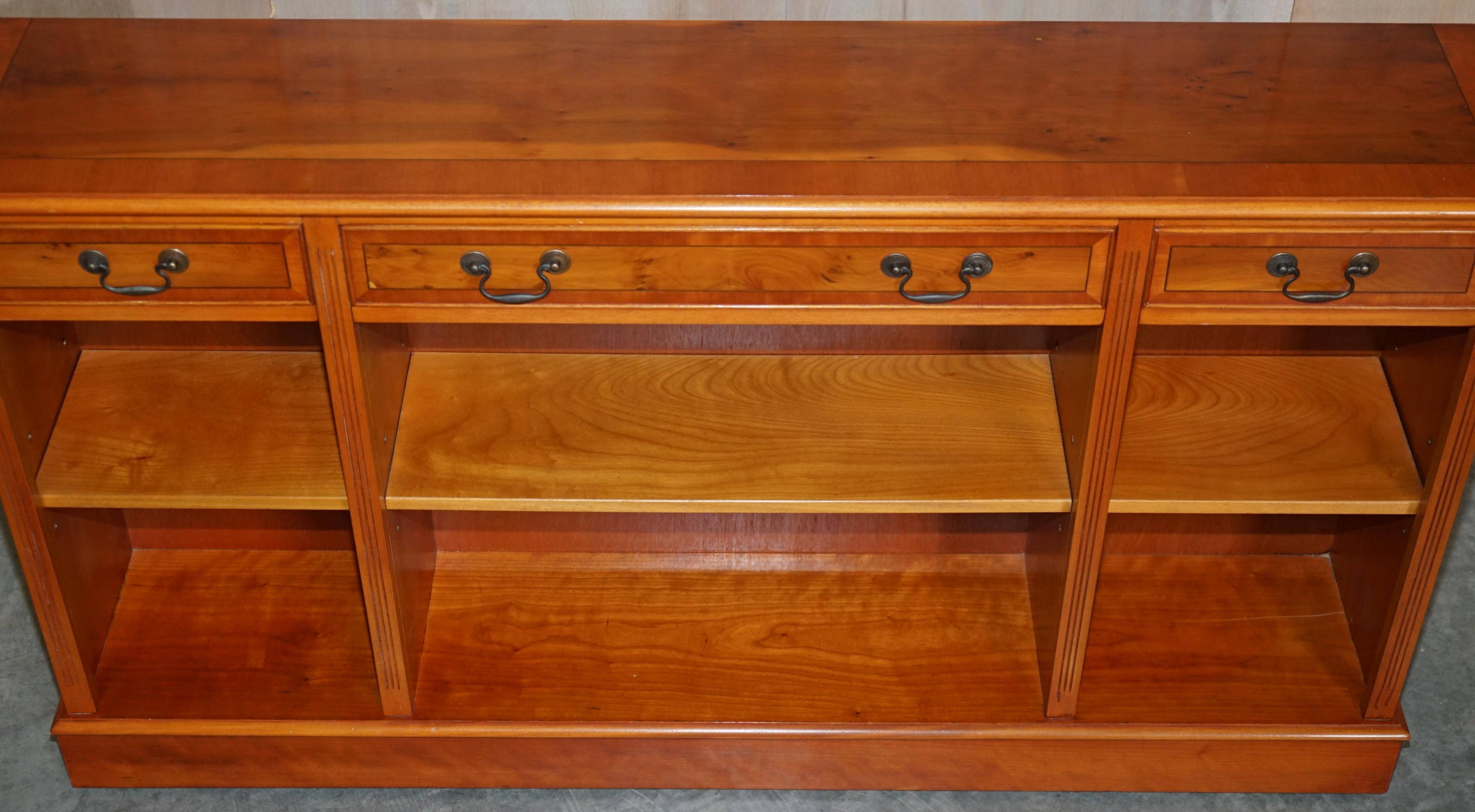 Vintage yew wood library/buffet with three drawers.