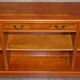 Vintage yew wood library/buffet with three drawers.
