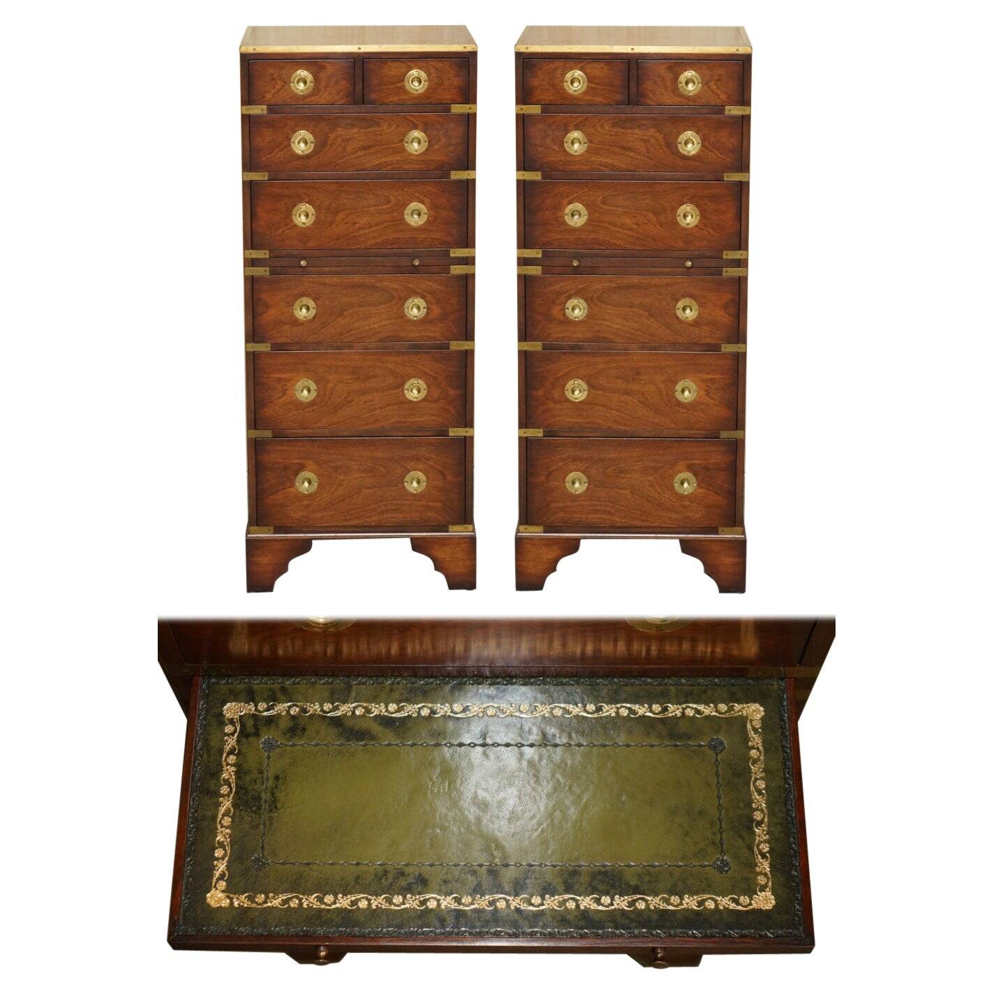 Pair of vintage military campaign high chests of drawers with leather tops.