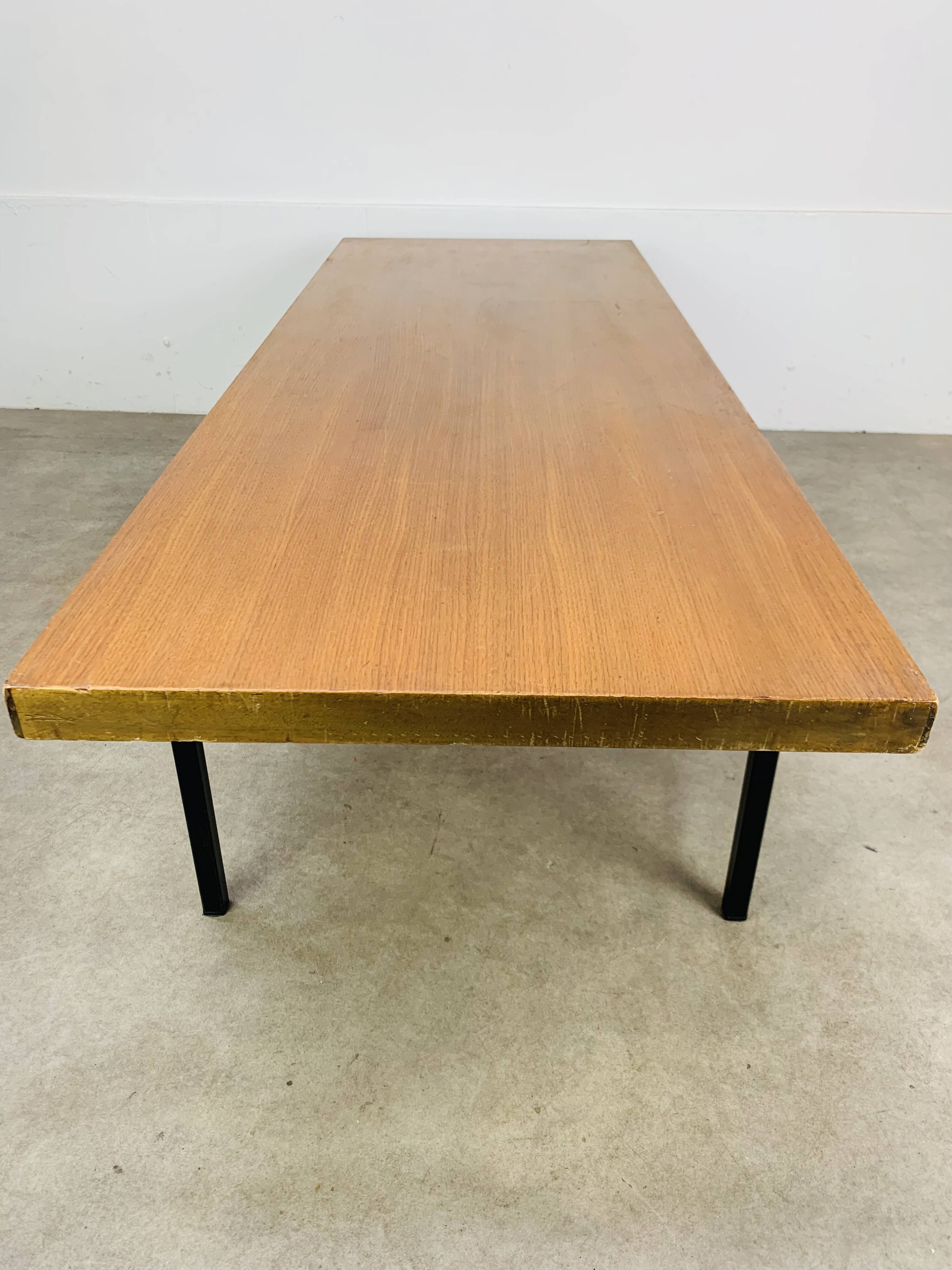 1950s modernist coffee table, wood and black metal.