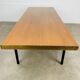 1950s modernist coffee table, wood and black metal.