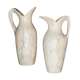 2 jugs in rough cut stone