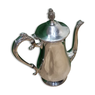 Vintage steel teapot covered in silver