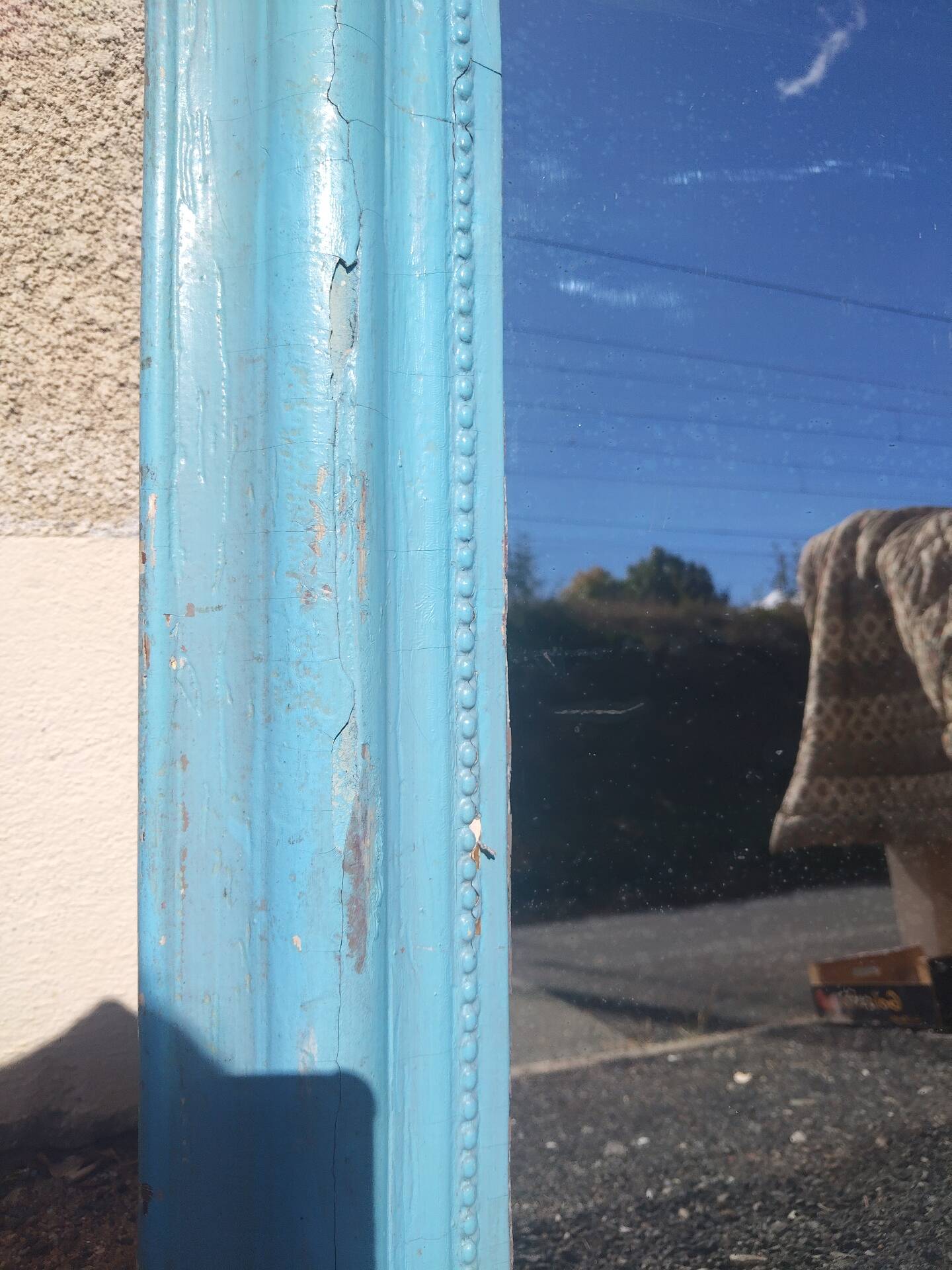 Large Louis-Philippe mirror from the 19th century in wood and stucco with a turquoise blue patina.