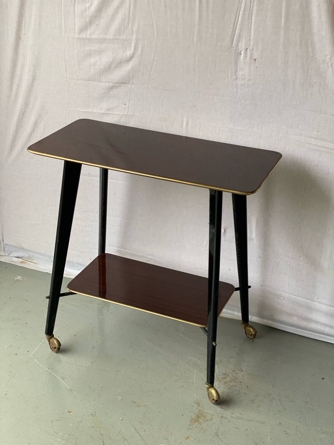 Vintage rosewood serving table on wheels from the 60s