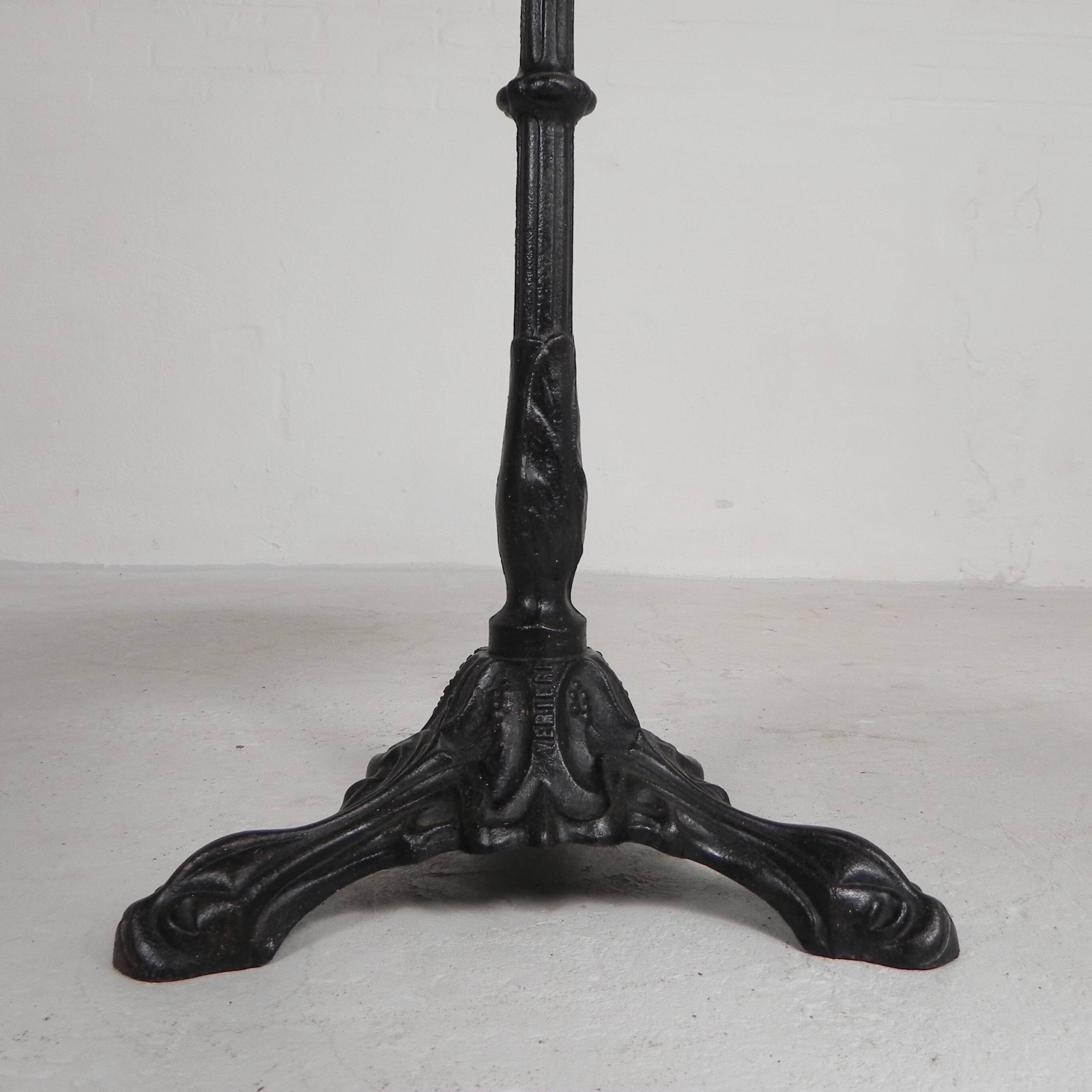 Bistro table with a cast iron base and a traffic sign as a tabletop, Paris 1920s.