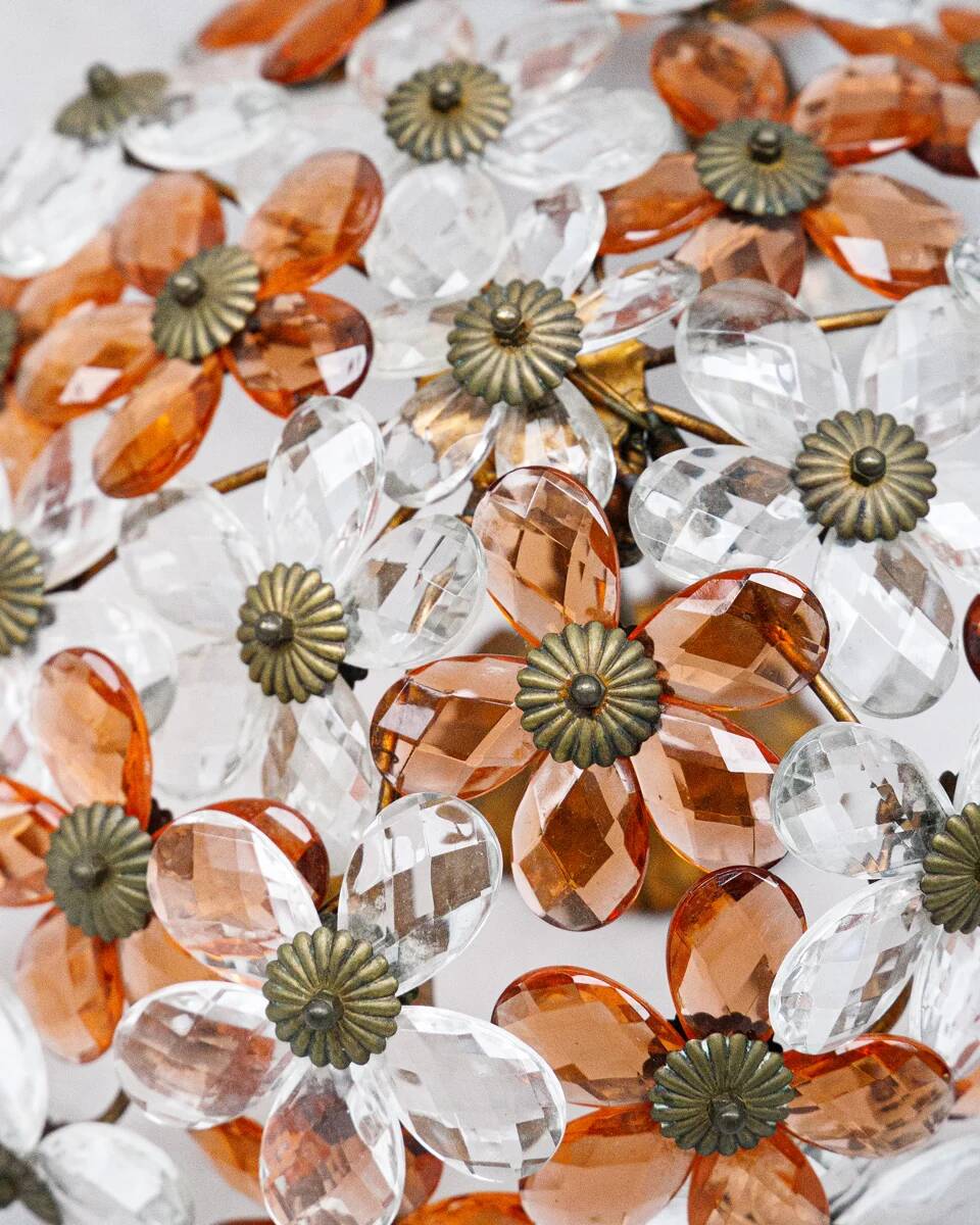 Ceiling light with transparent and peach flowers.