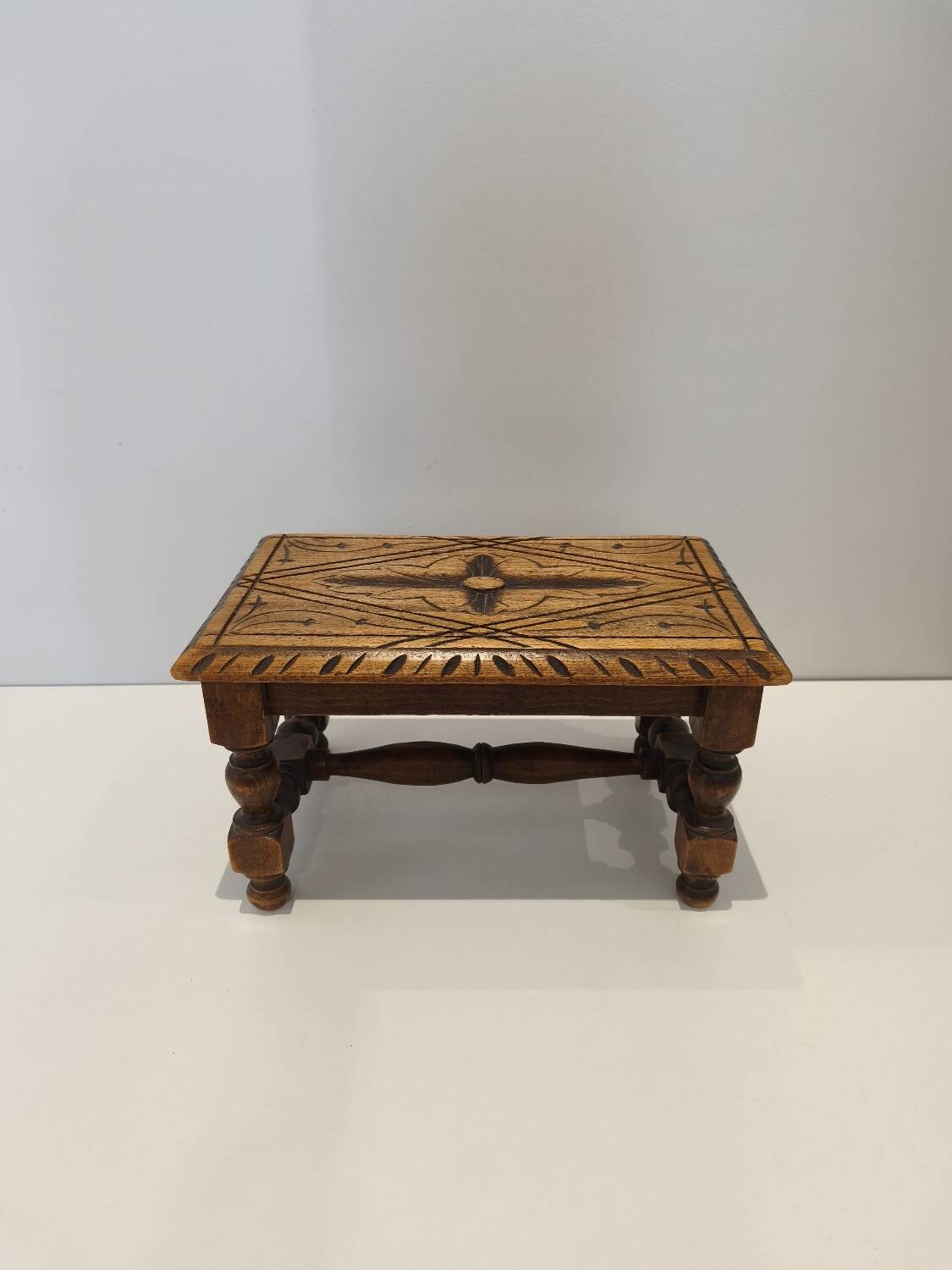 Small vintage carved solid wood footrest bench