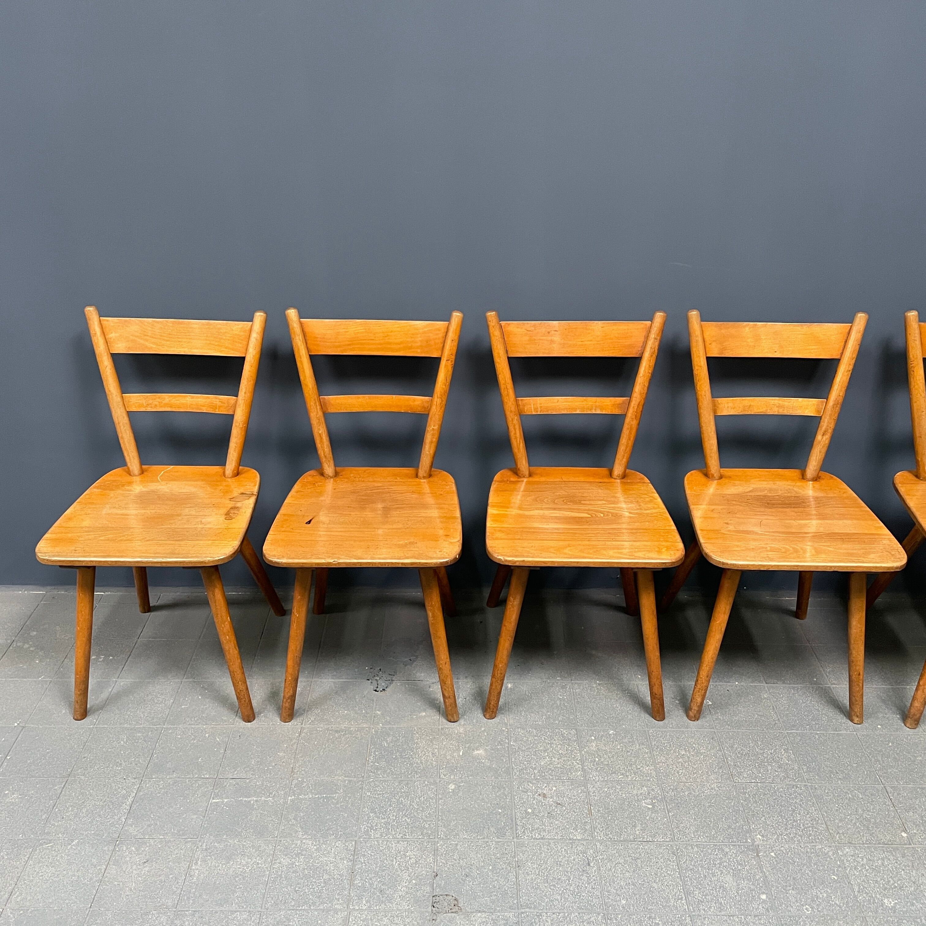 Set of eight german stick chairs from the 1950