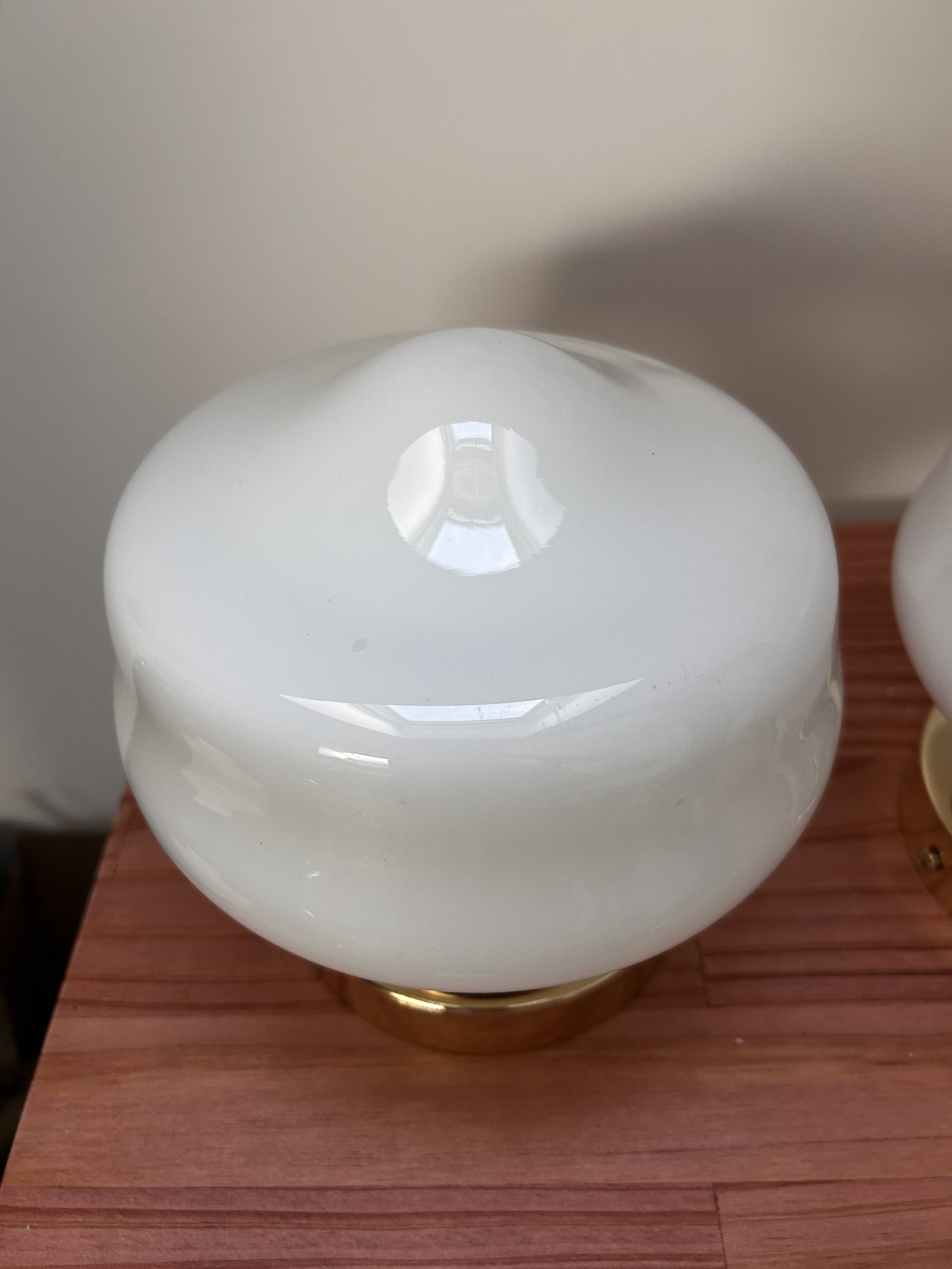 Pair of white opaline globe wall lights