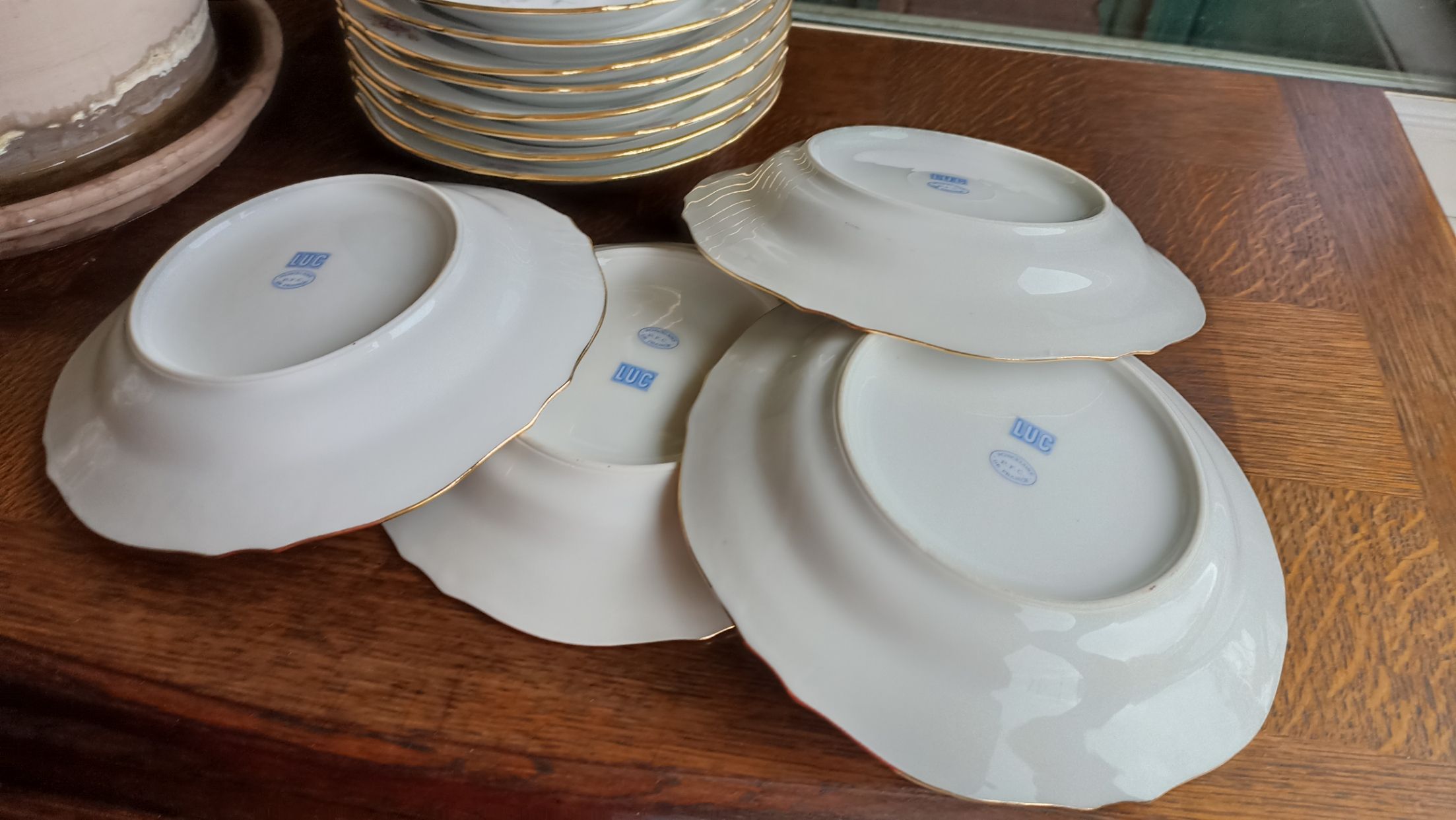 12 semi-hollow plates in Vierzon porcelain decorated with flowers and gilding