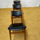 4 Scandinavian chairs in teak and black faux leather.
