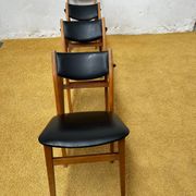 4 Scandinavian chairs in teak and black faux leather.