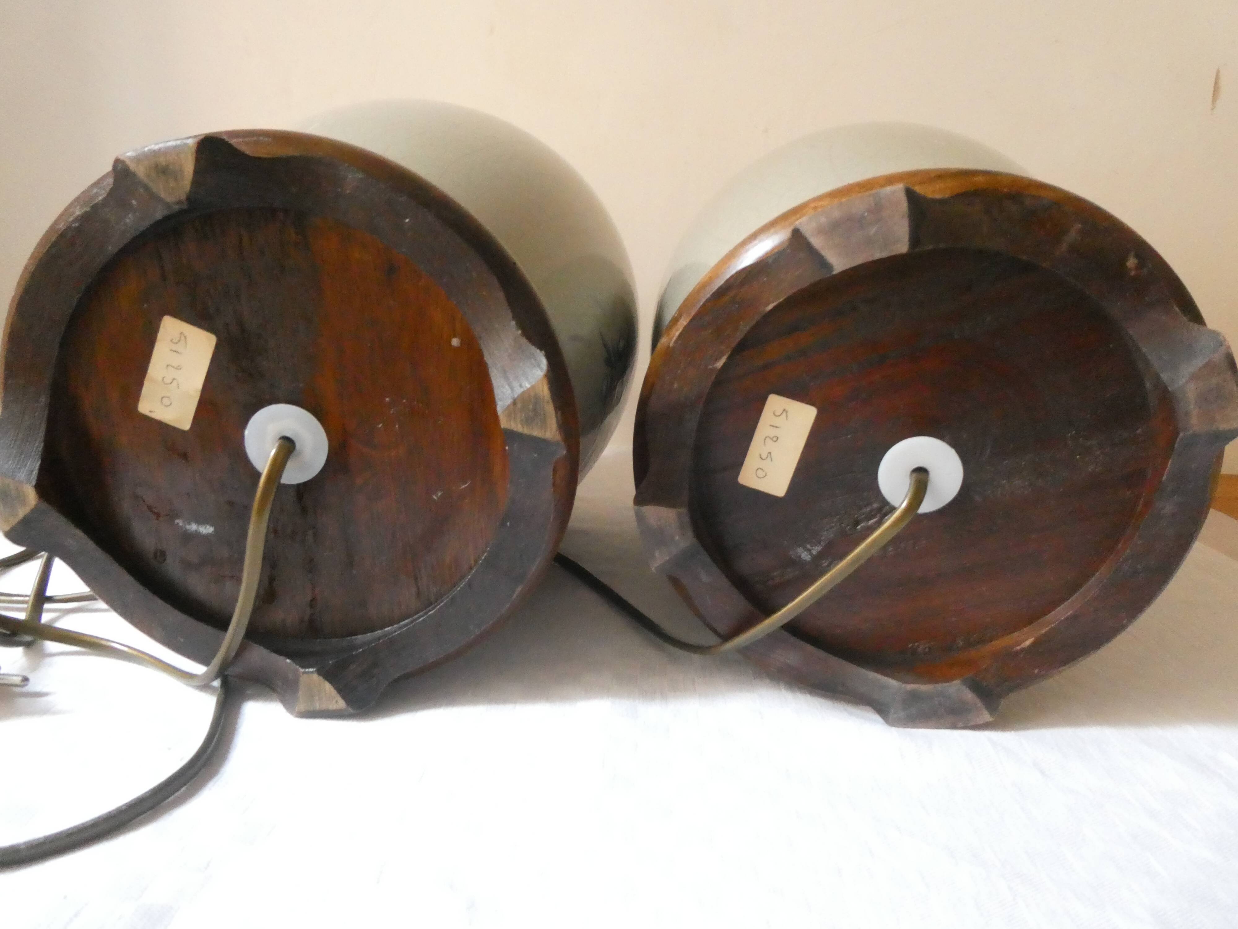 Pair of celadon crackle ceramic lamp bases decorated with flowers.