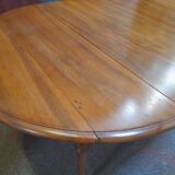 Round table with walnut shutter with extension