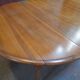 Round table with walnut shutter with extension