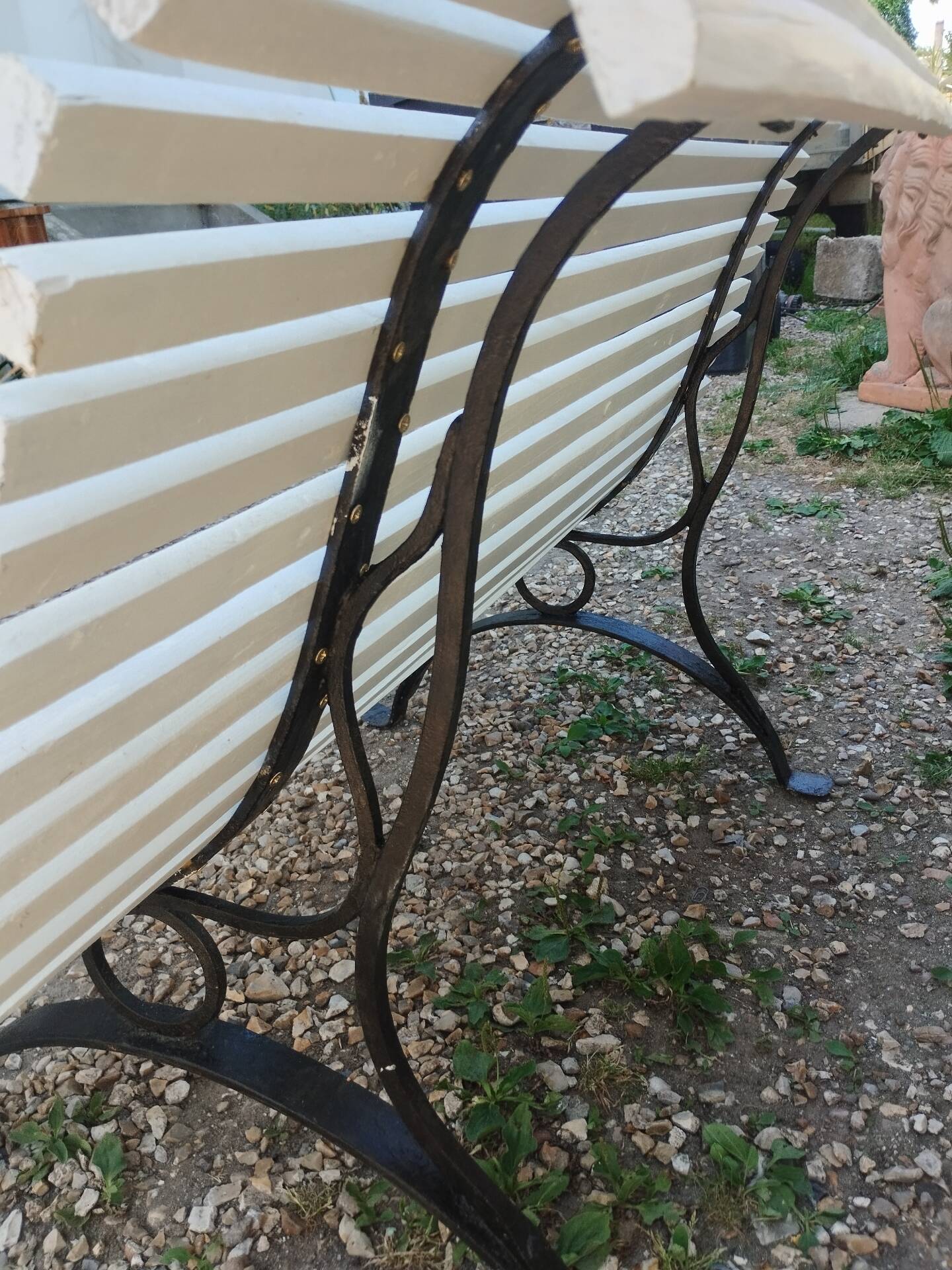 Antique garden bench with cast iron legs