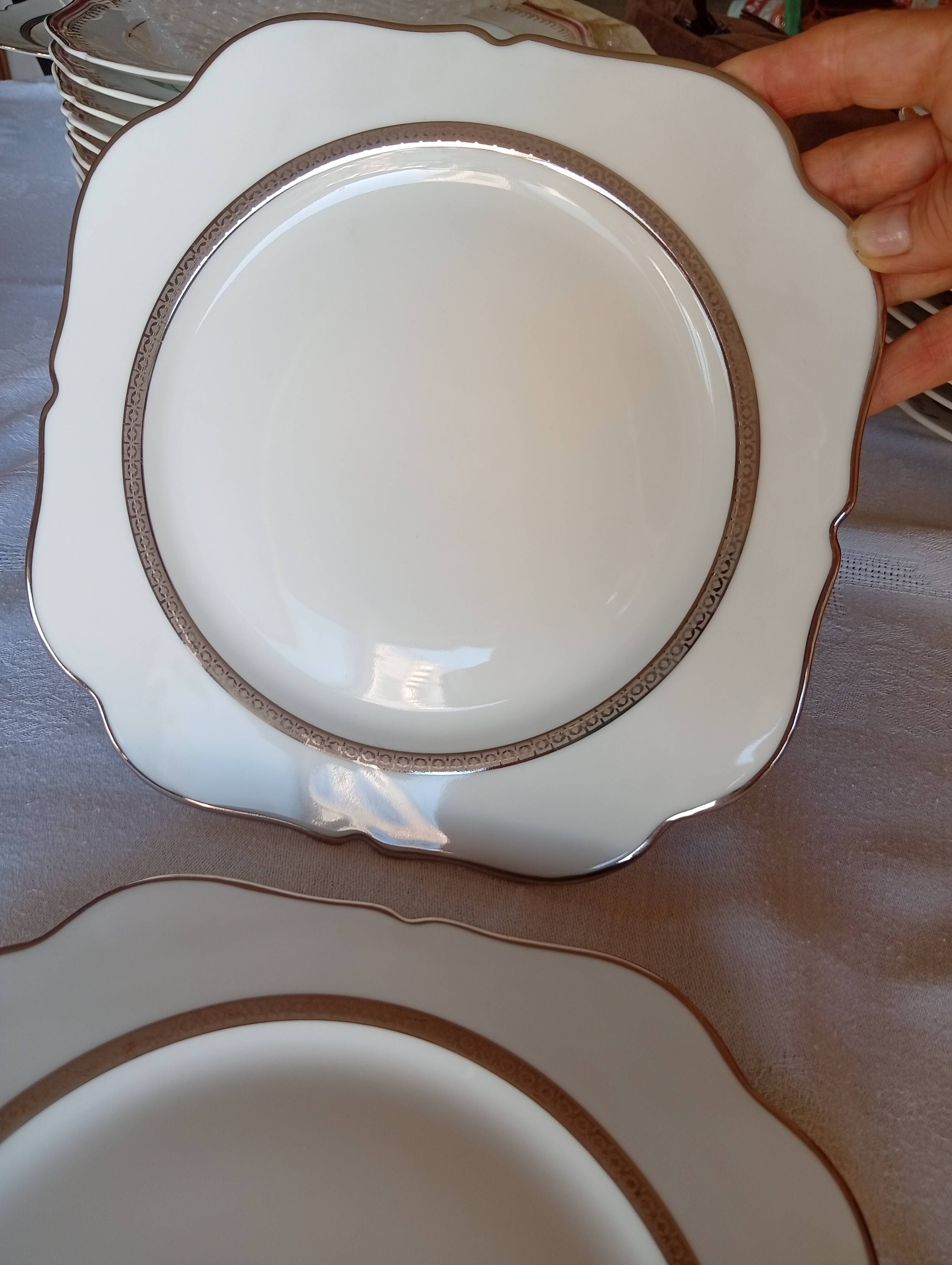 Jean BOYER Limoges FRANCE part of a white porcelain table service.