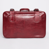 Red faux leather suitcase