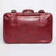 Valise rouge en simili cuir