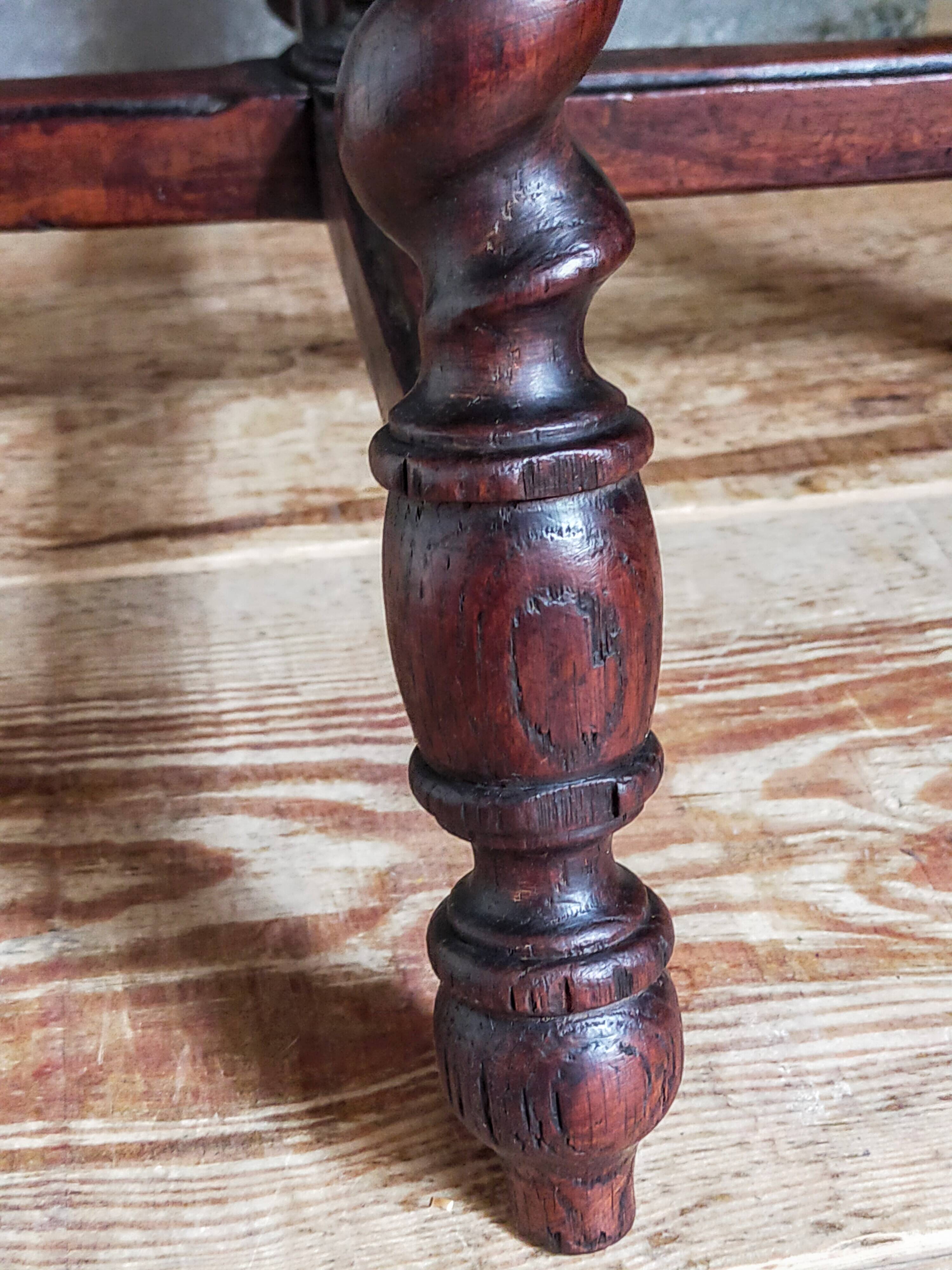 Antique stool in turned and carved solid wood