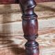 Antique stool in turned and carved solid wood