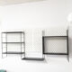 Black metal wall shelf, 1960