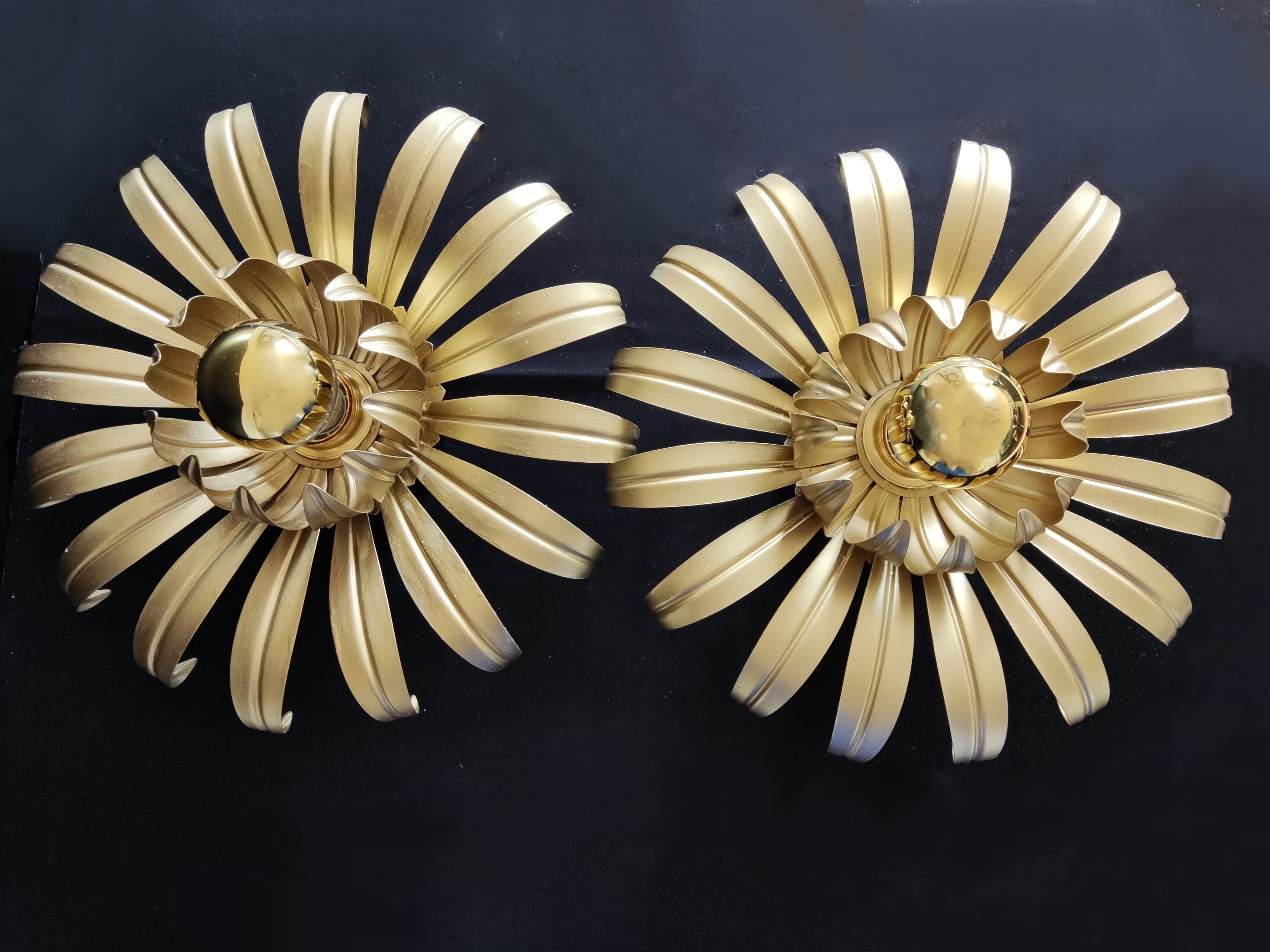 Golden metal flower sconces